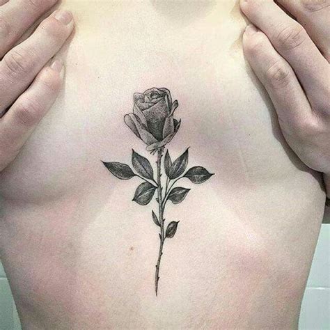 sternum between breast tattoos|Tattoo between breast